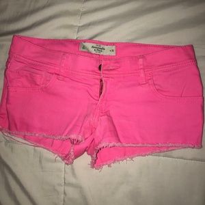 Abercrombie & Fitch neon cutoff shorts.